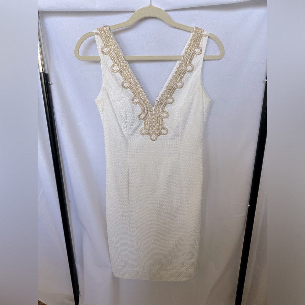 White dress with gold trim
